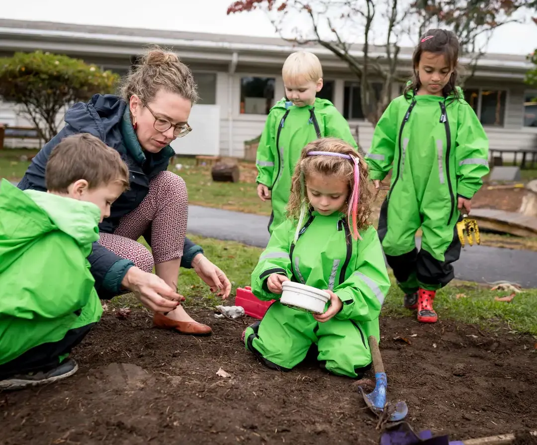 Teacher and students in an outdoor lesson.