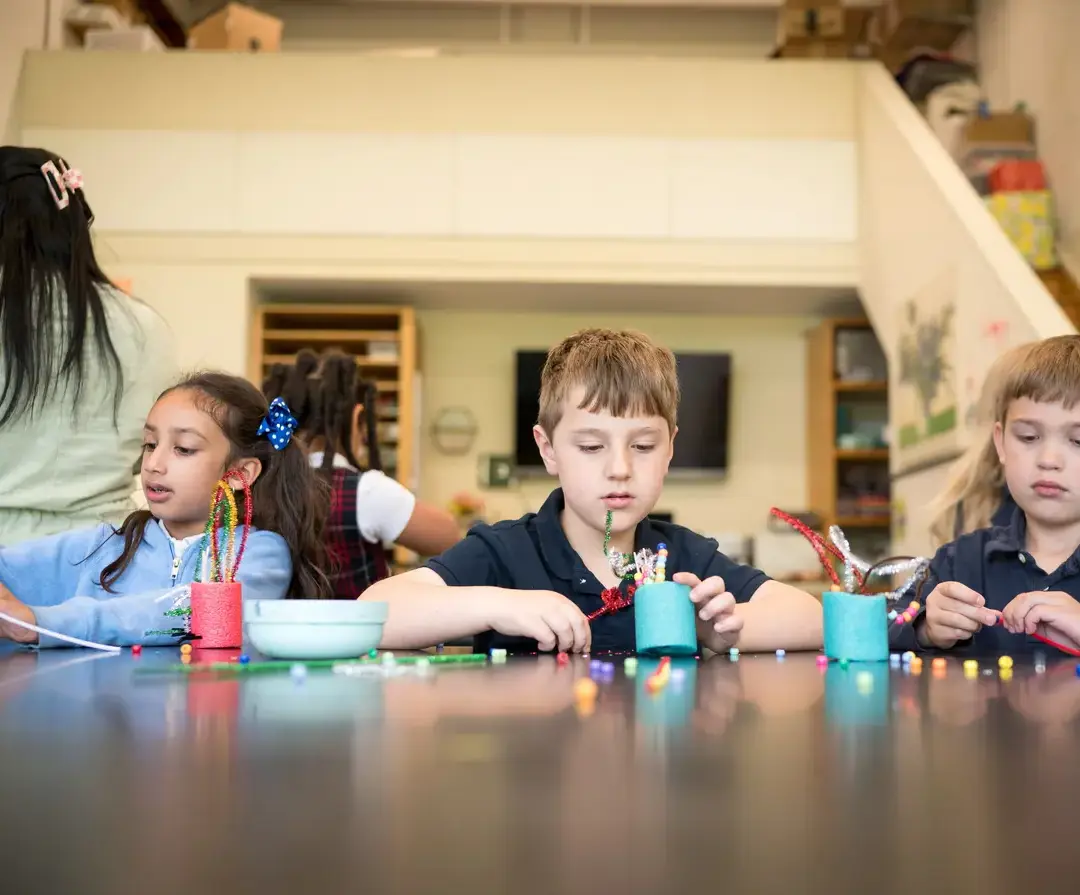 King School lower school students working on an art project.